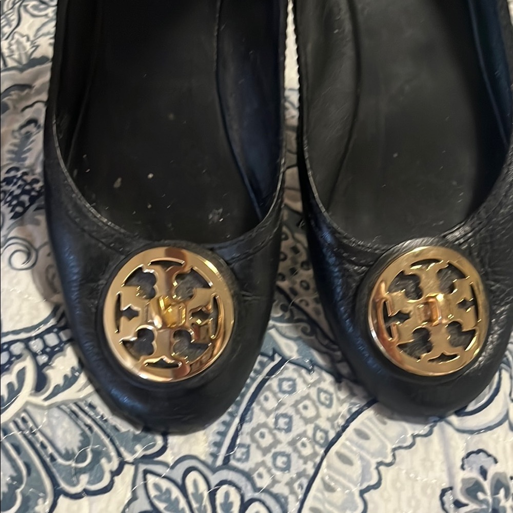 Tory Burch Black and Gold Flats with Logo Medallion